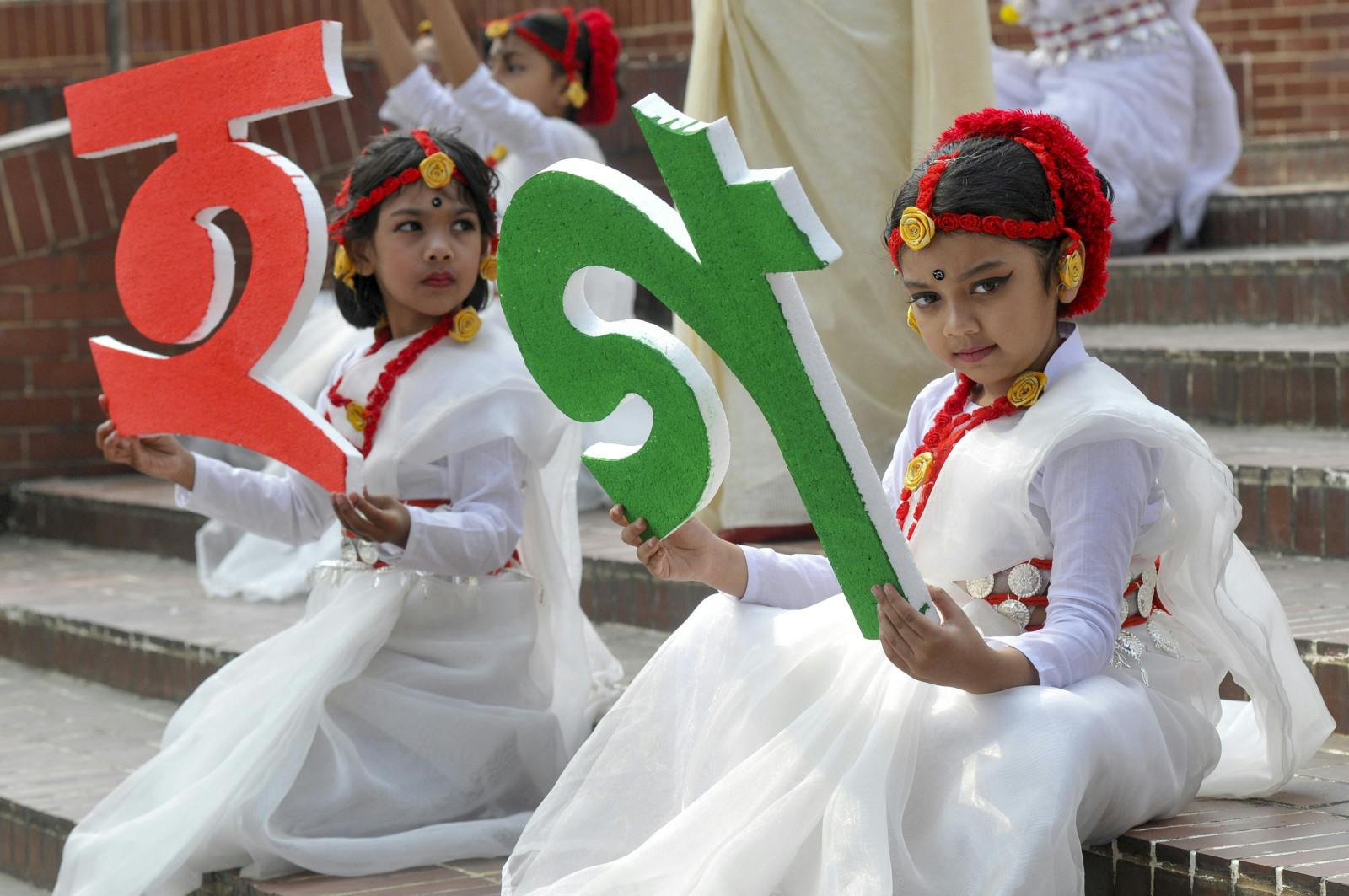 Dancers preparing for a performance for Language Month at Sylhet Central Shaheed Minar which was celebrated with an alphabet procession in Sylhet, Bangladesh (Majority World/Universal Images Group via Getty Images)